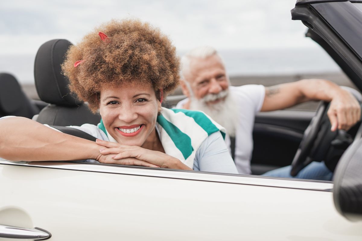 multiracial-senior-couple-having-fun-on-road-trip.jpg